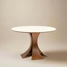 Elowen Round Dining Table with white top and sculpted walnut base against neutral beige background