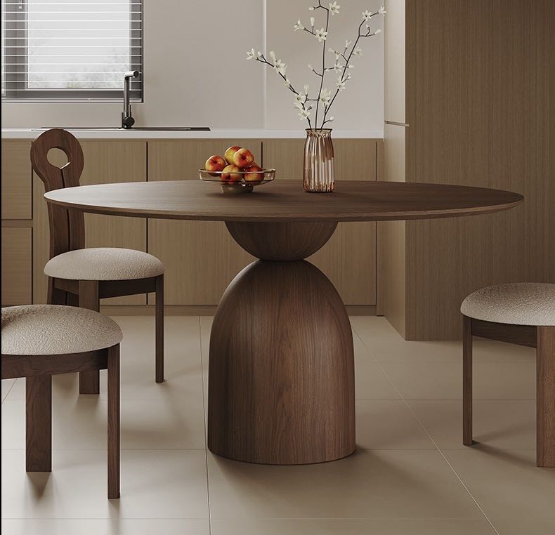 Evelyn walnut round dining table with sculptural pedestal base in modern kitchen