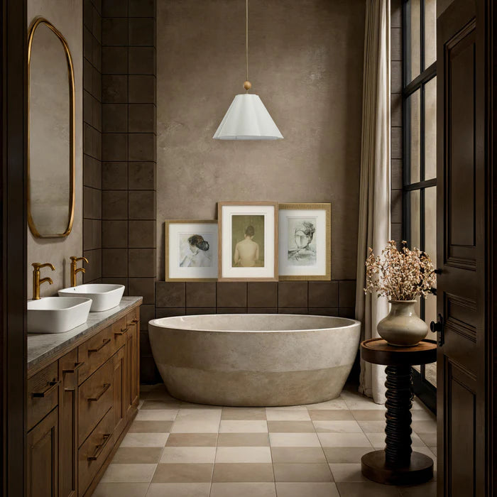 The Florence framed portrait styled as part of a trio gallery wall above a stone bathtub in an elegant bathroom.