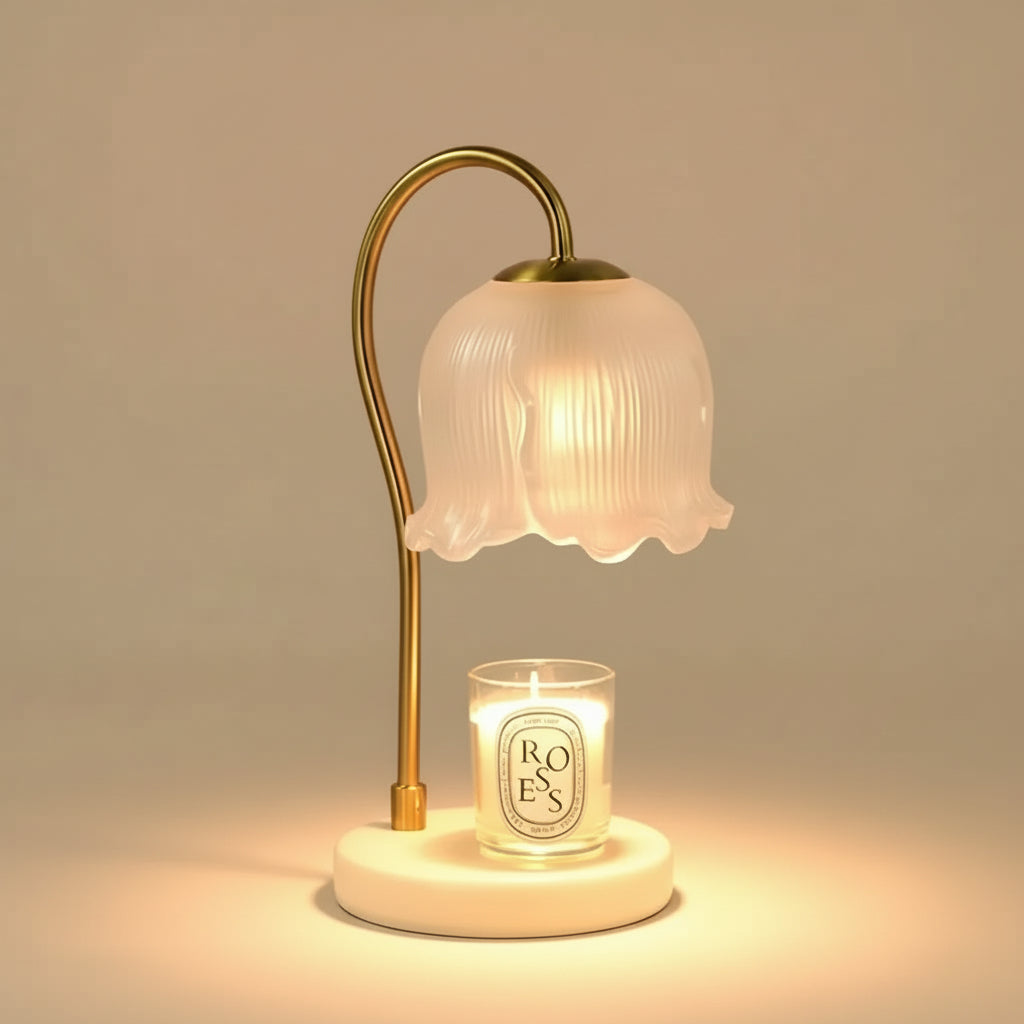 Elegant Glass Flower Candle Warmer Lamp with frosted floral shade and brass curved stand warming a lit candle.