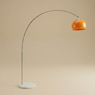 Floor lamp with orange shade and marble base on a beige background