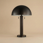 Front view of the Harrison table lamp showing the brown faux leather wrapped column stem and oil-rubbed bronze metal finish.