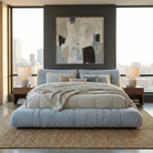 Front view of the Italian-style cloud bed in blue, showcasing the wide upholstered side rails and plush headboard.