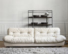 Italian-style Cloud Sofa in cream ultra suede upholstery with tufted cushions, displayed in a bright modern living room
