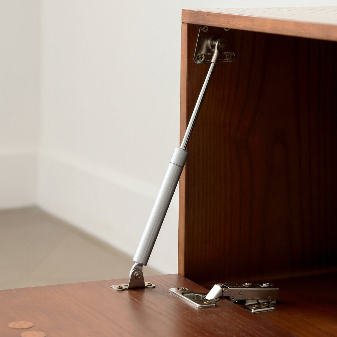 Interior hinge and support hardware of the Jasper Modular Sideboard, showing durable metal construction.