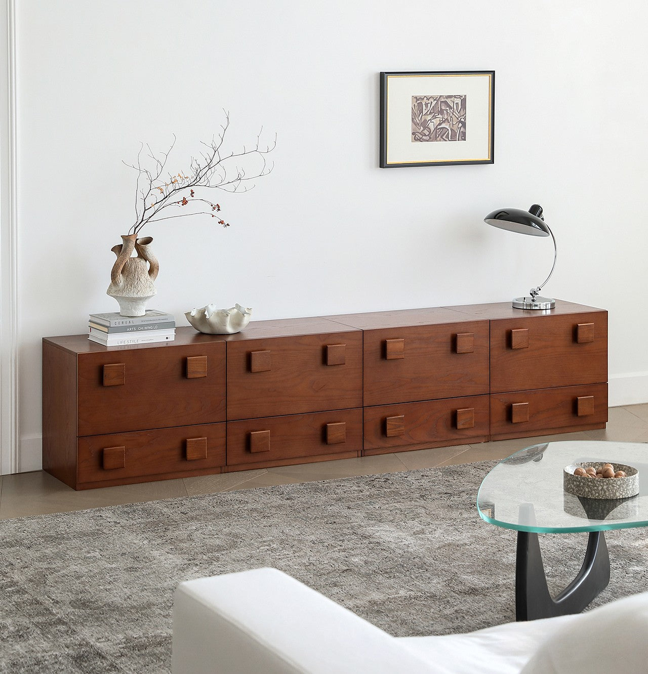 Jasper Modular Sideboard in a long low configuration with walnut finish and square drawer handles in a modern living room.