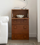 Jasper Modular Sideboard with top compartment open, showing interior storage, styled beside a sofa in a modern living room.