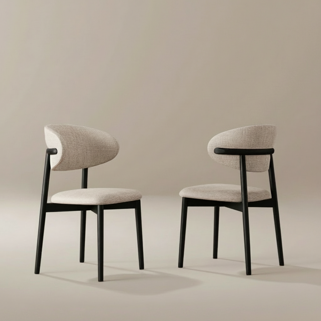 Two modern chairs with black frames and beige linen cushions on a neutral background