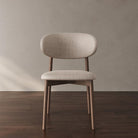 Front view of Linen Ash Wood Dining Side Chair with curved backrest and beige upholstery