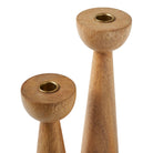 Close-up of Liora Candle Duo wooden holders showing smooth grain texture and brass candle inserts