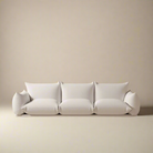 Loaf Bread Sofa in white fabric with plush cushions and pillow-like arms against neutral studio background
