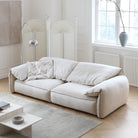Luxury Elephant Ear Sofa in cream ultra suede with soft slouchy cushions and rounded arms in a bright living room