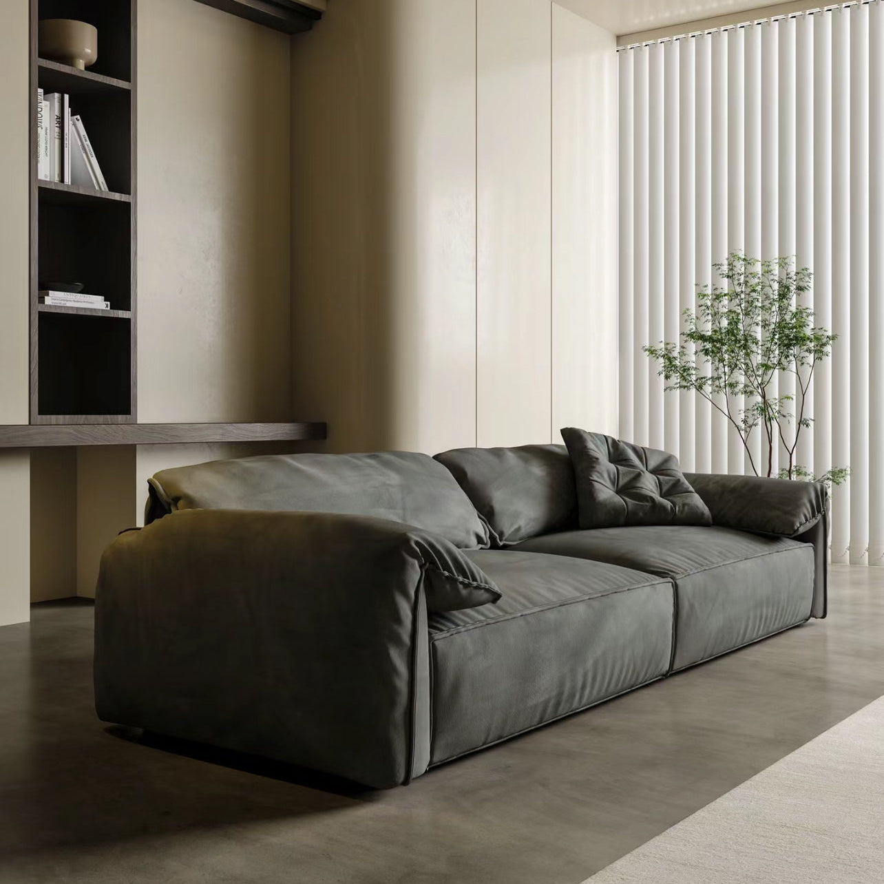 Luxury Elephant Ear Sofa in dark grey ultra suede with plush cushions and relaxed silhouette in a modern living room