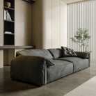 Luxury Elephant Ear Sofa in dark grey ultra suede with plush cushions and relaxed silhouette in a modern living room