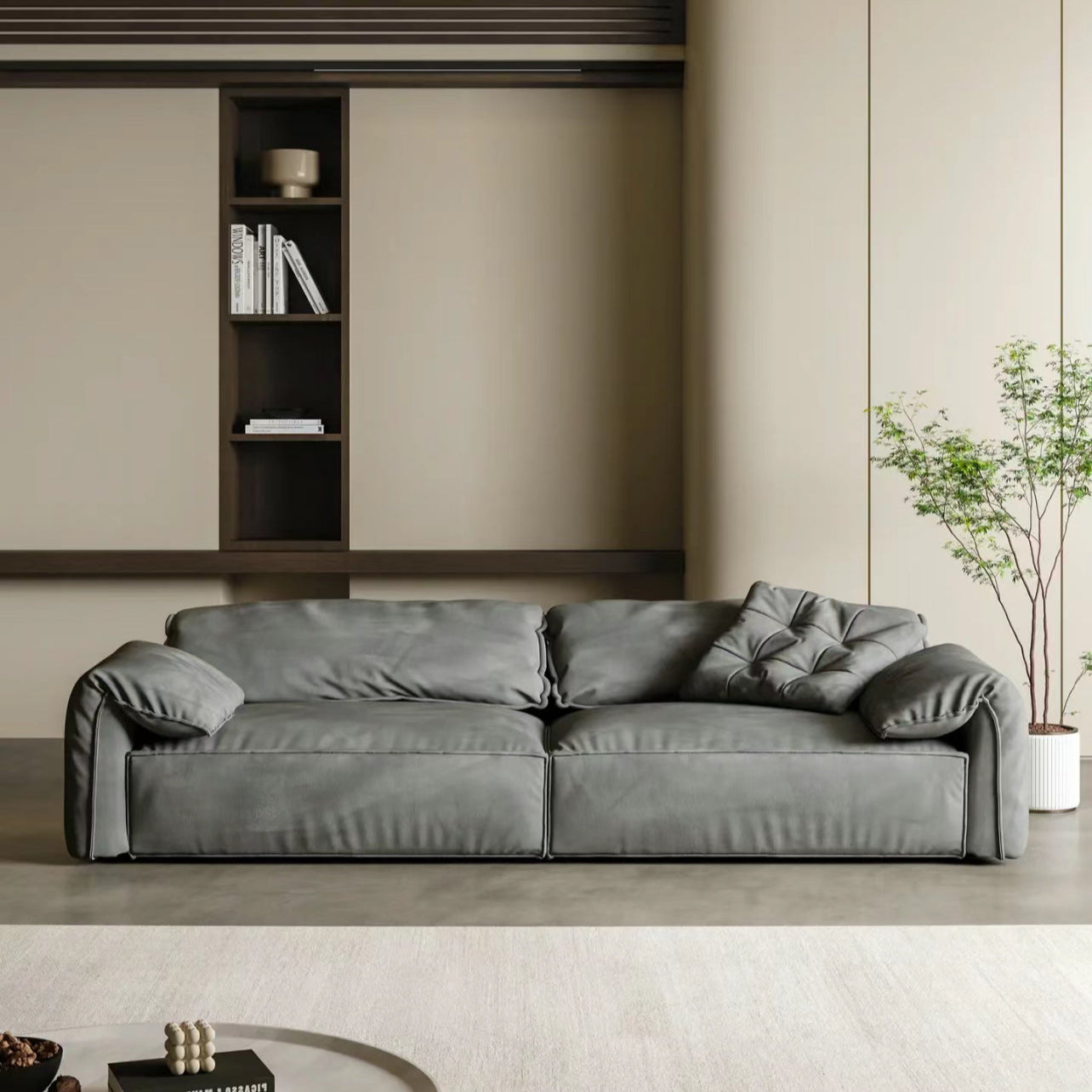 Luxury Elephant Ear Sofa in dark grey ultra suede with plush cushions and relaxed arms in a modern living room