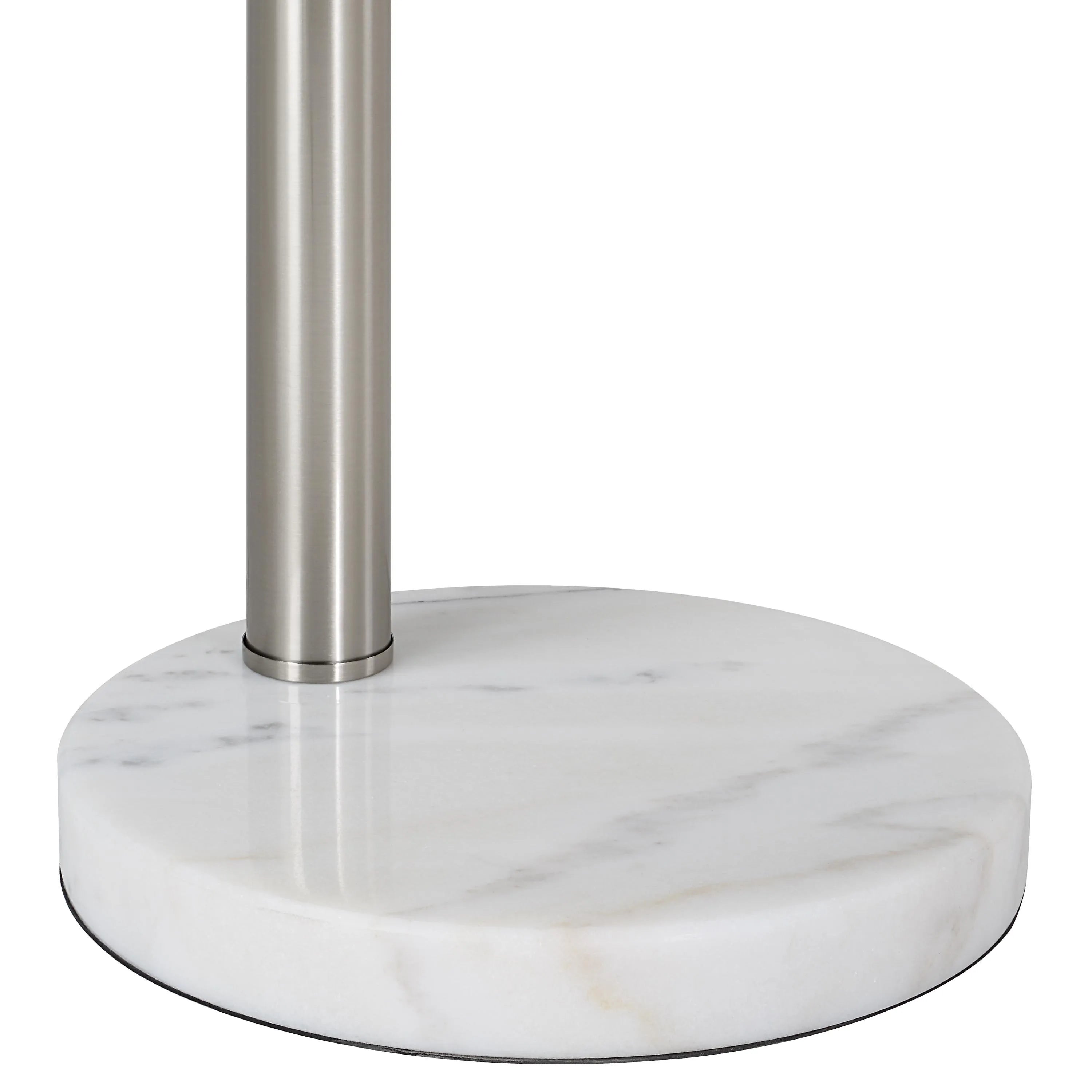 Close-up of Lyra Arc Floor Lamp featuring smooth round white marble base and brushed steel stem