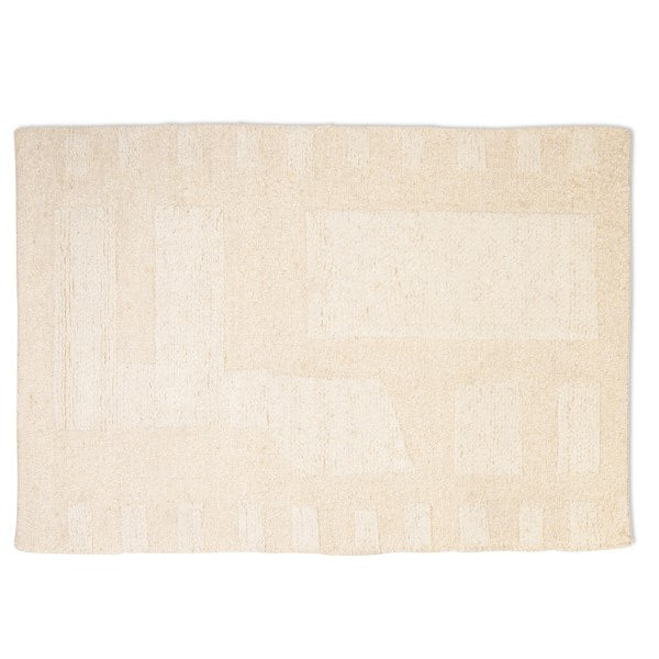 Full top-down view of the Maeve hand-woven wool rug in ivory, featuring a tonal abstract geometric pattern with textured block shapes.