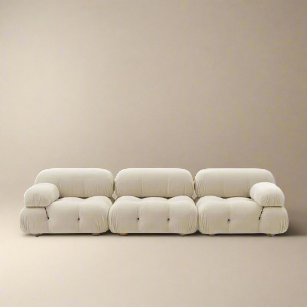 Mario Bellini Sofa - Cozy Furniture & Mario Bellini Sofa in white fabric featuring plush tufted cushions and rounded armrests on a soft beige studio background
