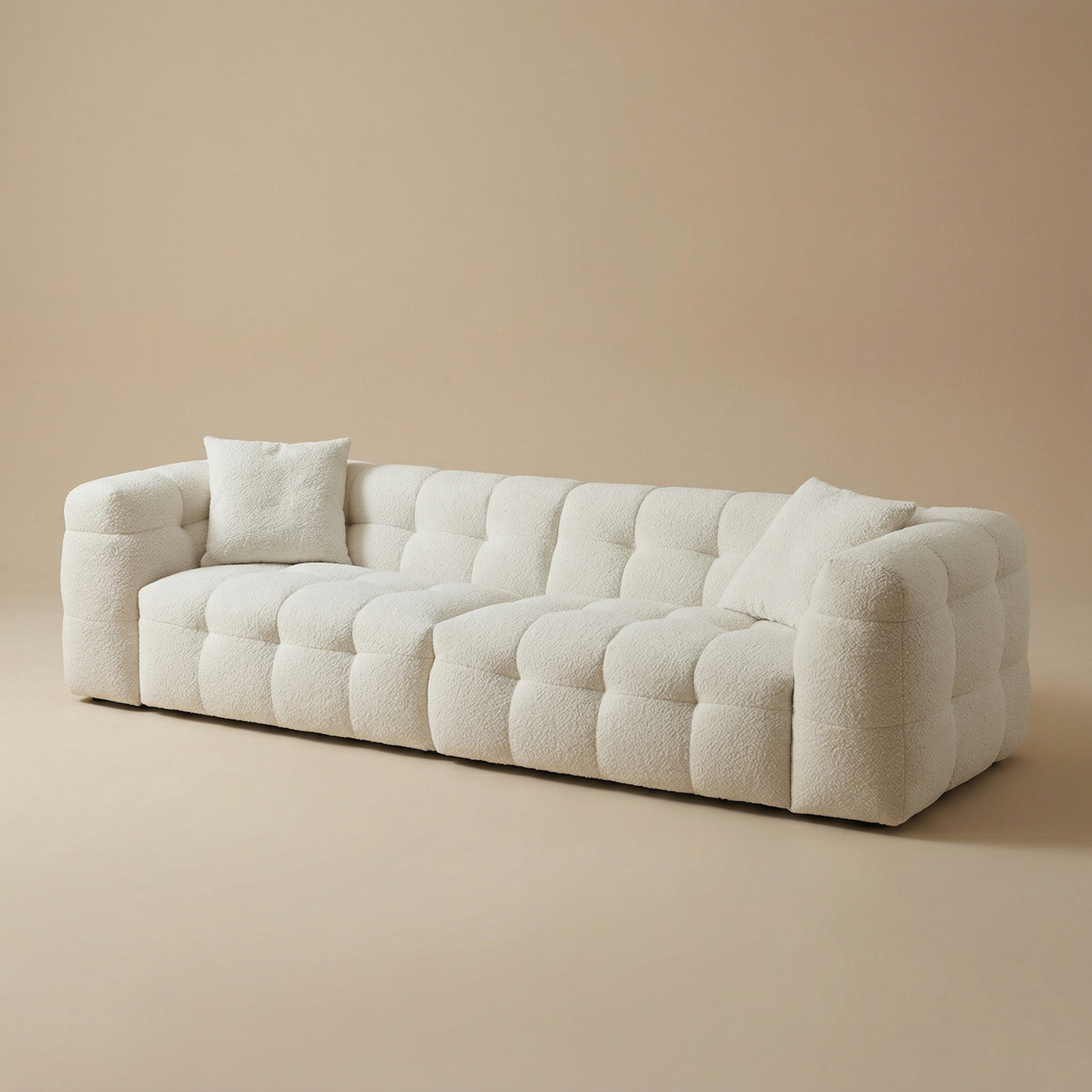 Angled studio view of the Marshmallow sofa showcasing its deep, voluminous tufted sections and low-profile silhouette.