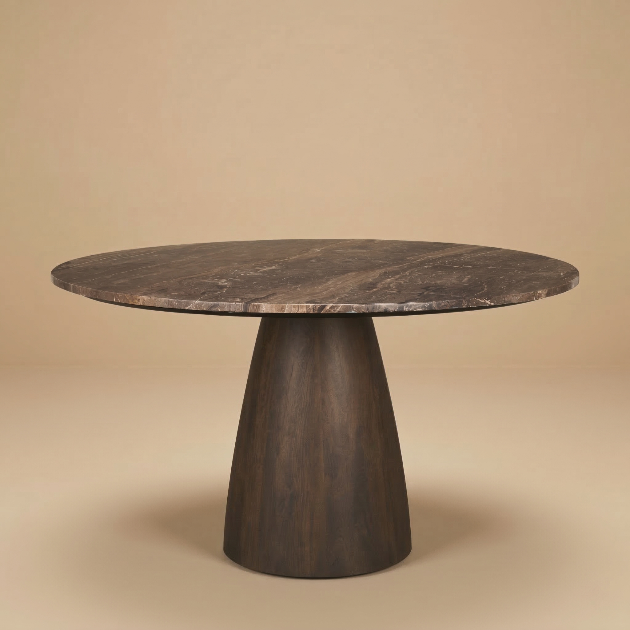 Full front view of the Mateo round dining table featuring a dark brown marble top and a tapered conical dark wood pedestal base.
