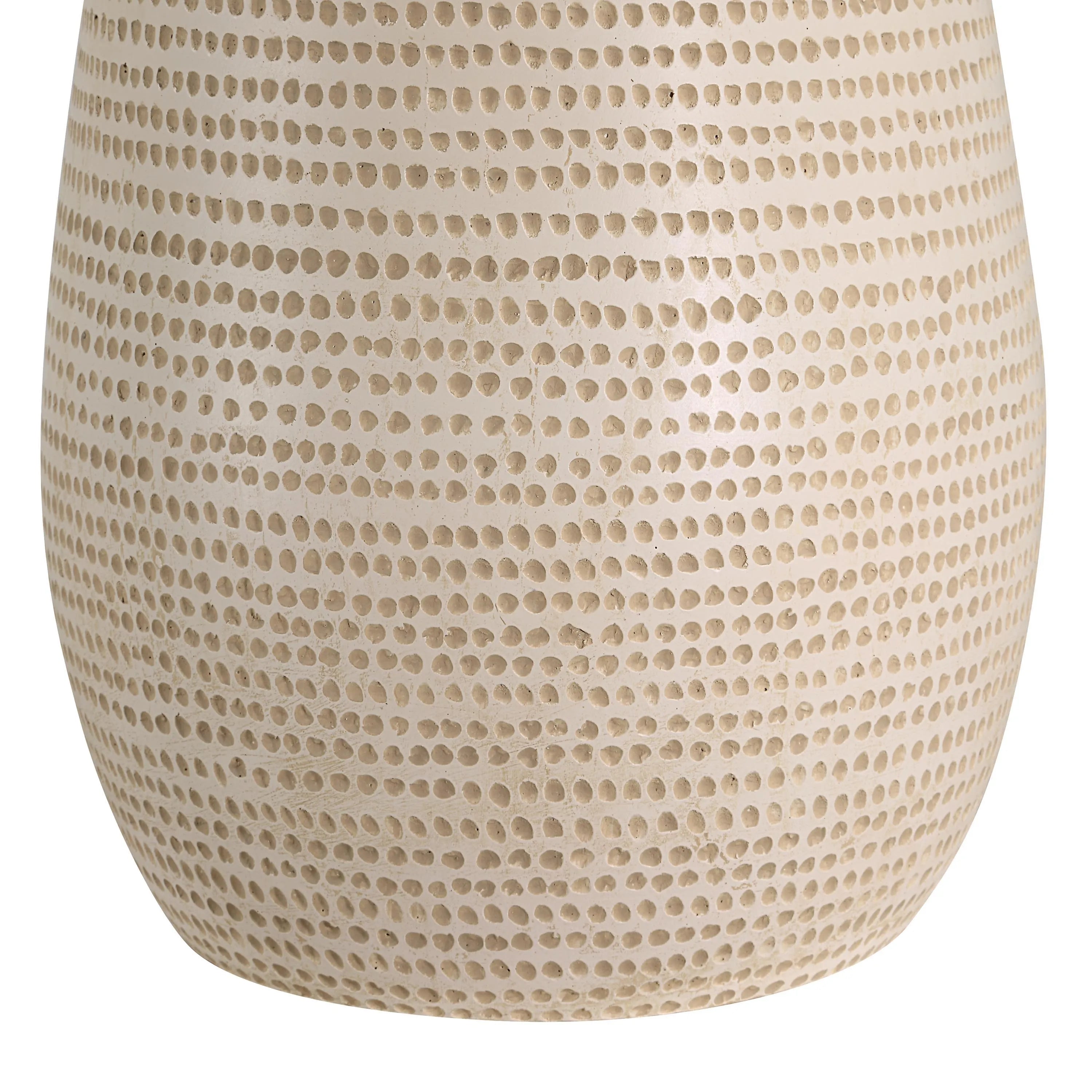 Close-up of Mesa Glow Table Lamp base showing textured ceramic pattern in warm beige tone