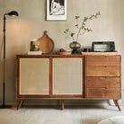 Mid-Century Rattan Craft Sideboard with sliding cane doors and wood drawers in a cozy modern dining space.