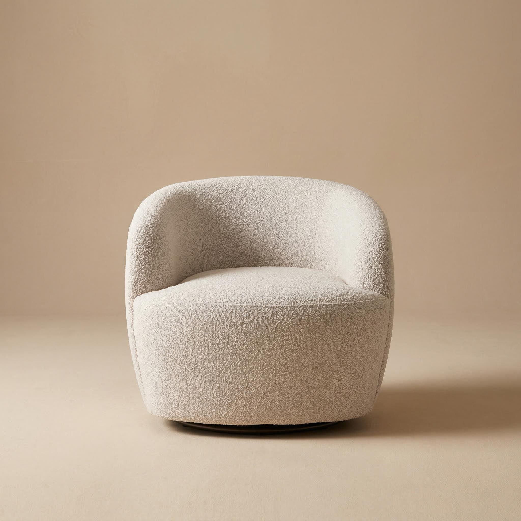 Full front view of the Milo swivel chair featuring rounded armrests and textured buff bouclé upholstery.