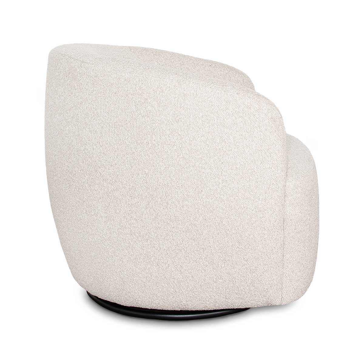 Side profile of the Milo swivel chair showing the gentle curve of the backrest and the hidden black swivel base.