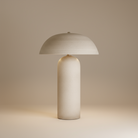 Mira Ceramic Table Lamp with curved dome shade and rounded beige ceramic base on neutral studio background