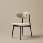 Modern Leather Ash Wood Dining Side Chair with cream upholstery and dark ash wood legs in a neutral studio setting.