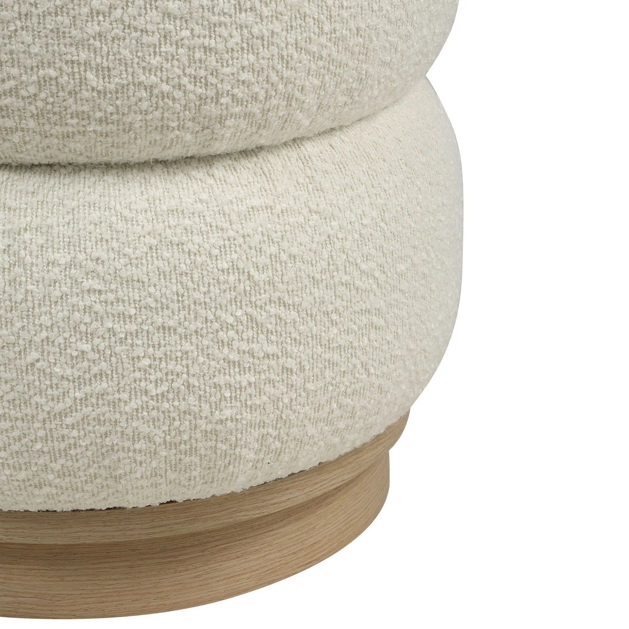 Close-up of the Moita stool highlighting the stacked, pill-shaped white bouclé cushions and the smooth natural light oak wood base.