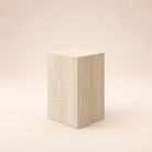 The Mono Side Table, a rectangular beige travertine-look block standing 20 inches tall on a neutral background