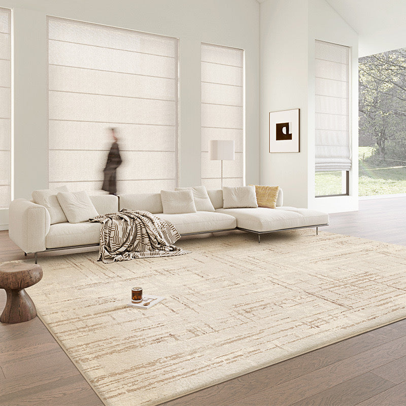Neutral Plains Rug styled in a bright living room with a cream sectional sofa and modern decor