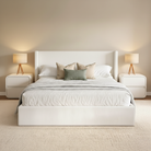 Modern bedroom with a white bed, nightstands, and lamps.