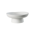 Orla Ceramic Bowl with soft matte white finish and sculptural pedestal base in studio lighting
