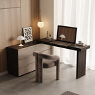 The Ovela vanity and dresser combo styled in a chic dressing room with a modern grey chair, artwork, and a standing mirror.