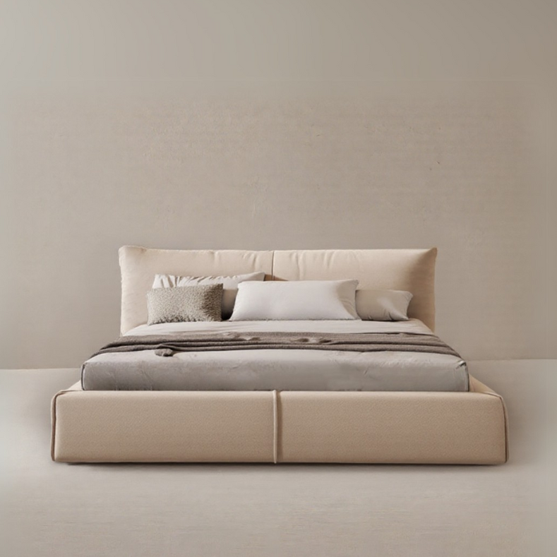 Paris Elegance Cream Platform Bed with plush cushioned headboard and layered bedding on beige studio background