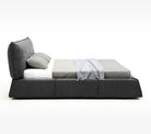 Paris Elegance Grey Platform Bed side profile showcasing low modern frame and plush angled headboard in studio setting