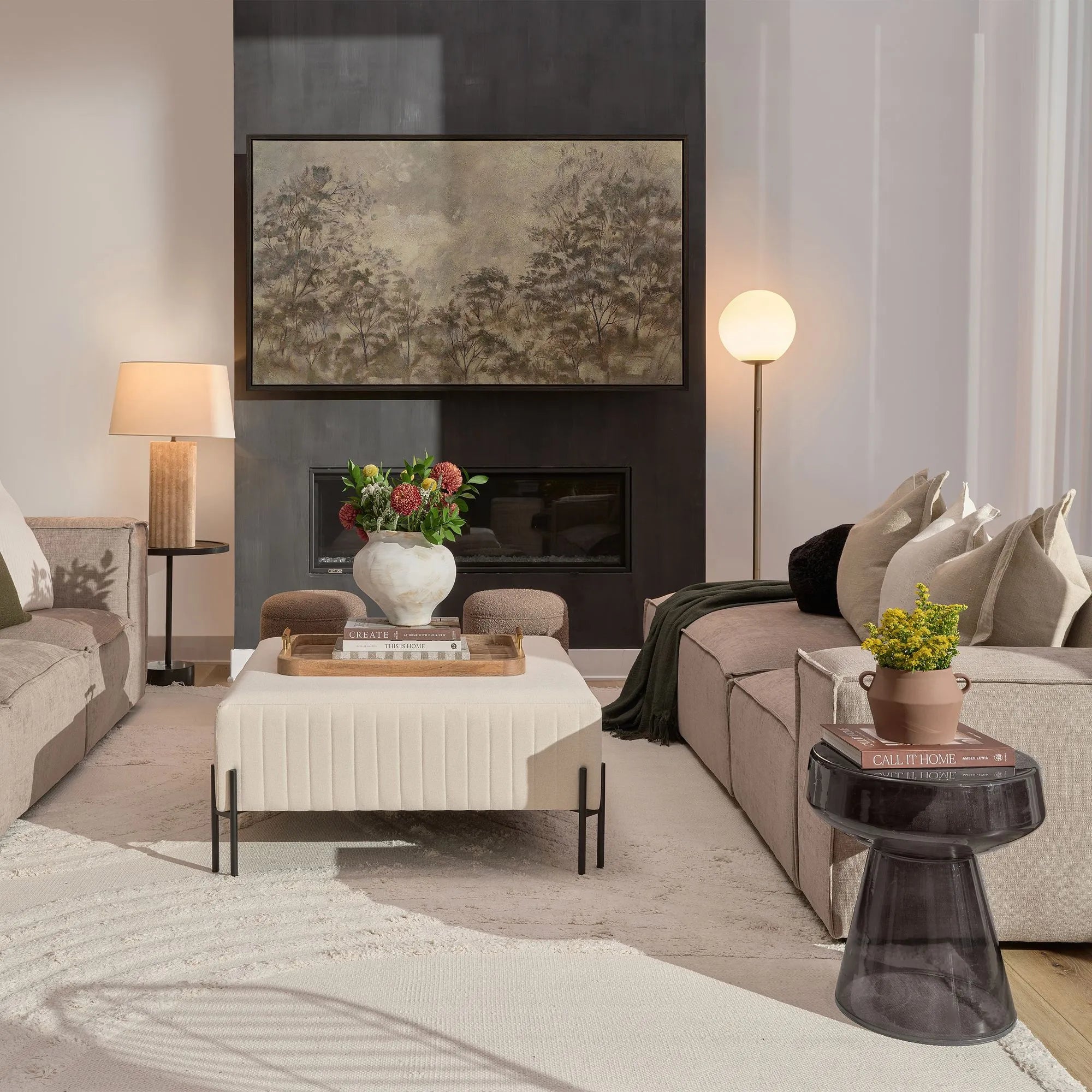 Pearl Glow Floor Lamp with white globe shade beside a modern sectional sofa in a cozy living room.