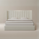 Plush Velvet Storage Bed with tall vertical panel headboard and soft ivory velvet upholstery in a minimal beige studio setting