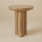 Ryn round side table in natural wood featuring three chunky cylindrical legs and a thick solid wood top.