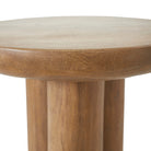Close up of the Ryn side table showing the thick solid wood top and smooth rounded edges.