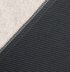 Close-up of the Serenity Stripes Carpet showing its textured surface and non-slip backing detail.