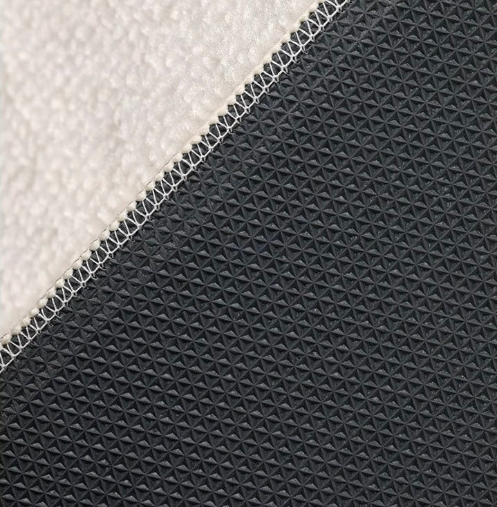 Close-up of the Serenity Stripes Carpet showing its textured surface and non-slip backing detail.