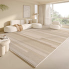 A modern living room with a large beige Serenity Stripes Carpet, paired with a white modular sofa and soft natural lighting