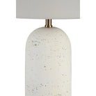 Close-up of Sienna Sculpted Table Lamp showing textured ceramic base with brass accent and fabric shade