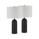 Pair of Sienna Sculpted Table Lamps in black with textured bases and white fabric shades on white background