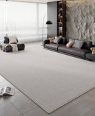 Slate Gray Area Rug styled in a modern living room with leather seating and stone accent wall