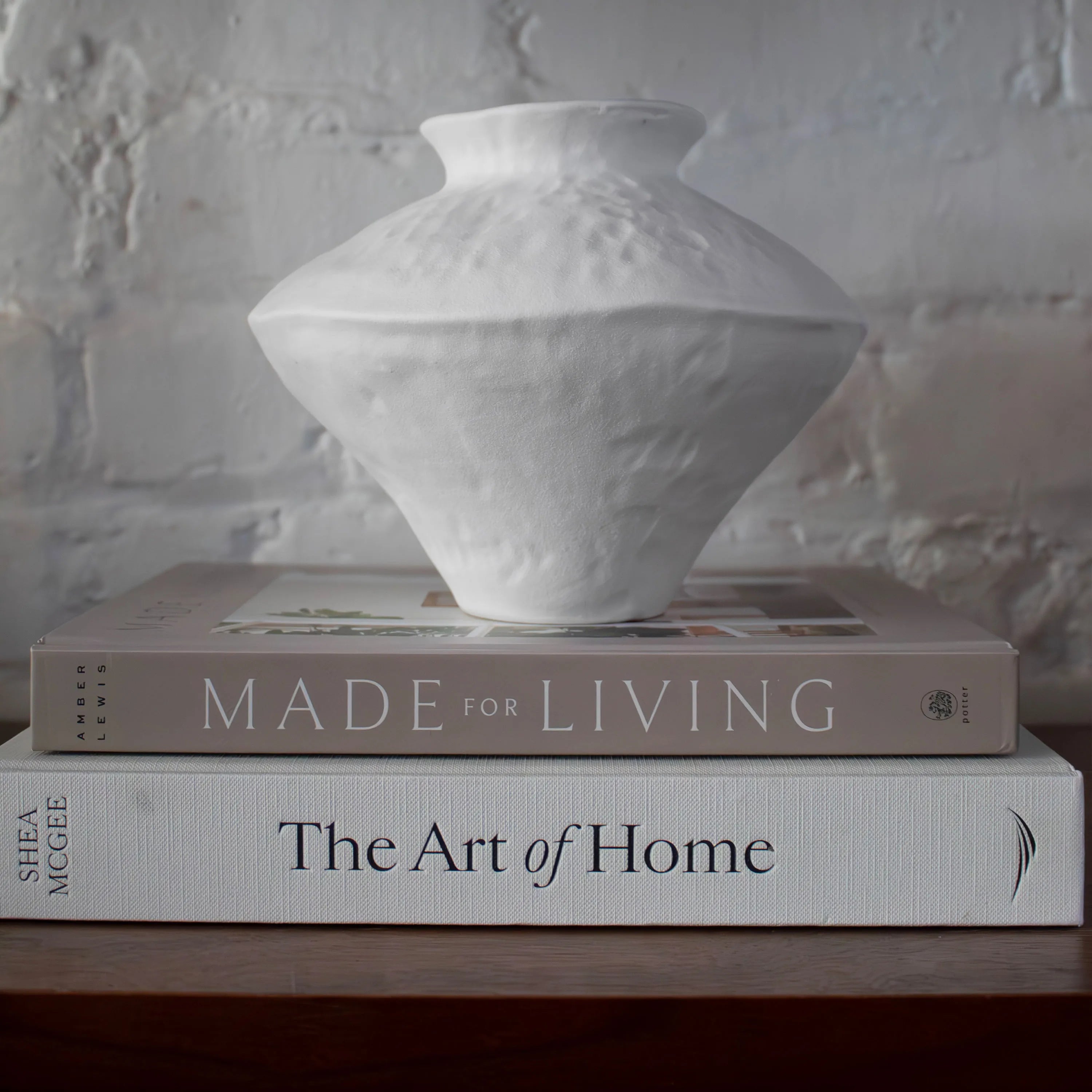 Solana Ceramic Vase displayed on stacked coffee table books Made for Living and The Art of Home