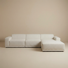 Beige sectional sofa on a beige background